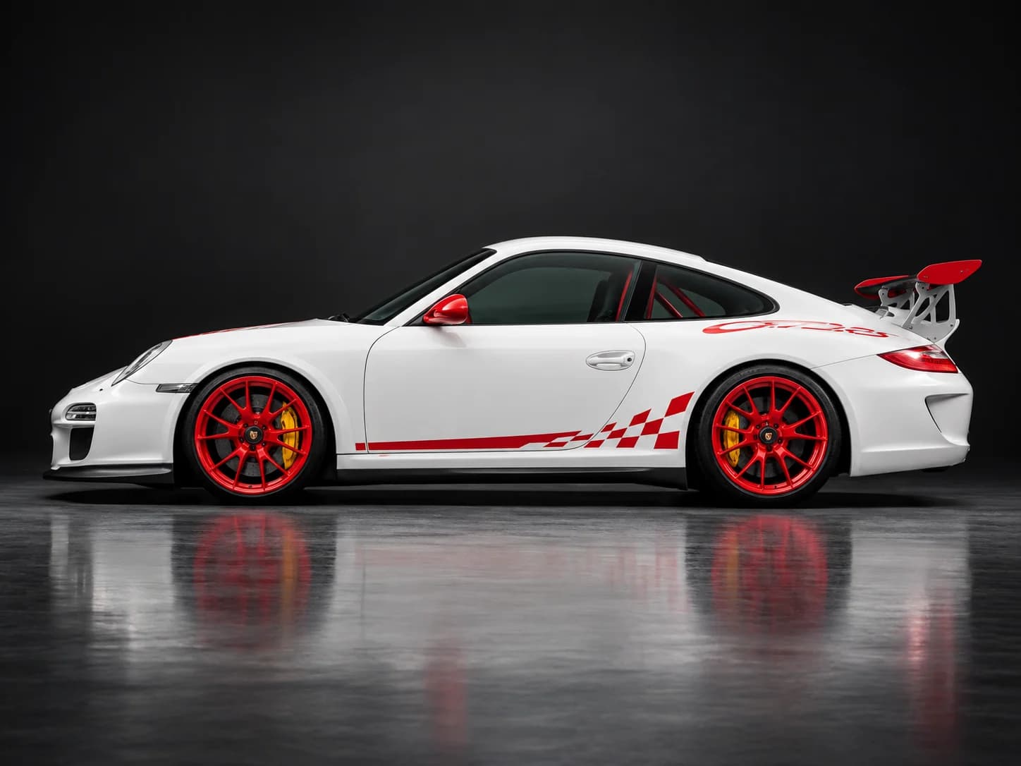 2010 Porsche 911 GT3 RS in Carrara White with Guards Red accents, side profile, illustration in a dark studio setting